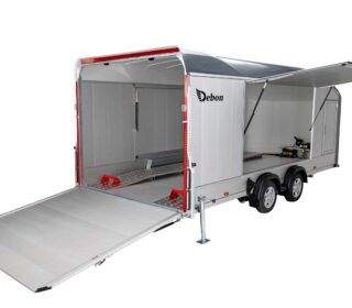Debon C2000 Enclosed Car Transporter with rear and side gull-wing doors open.