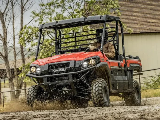 Kawasaki Mule Pro FX UTV being driven through mud