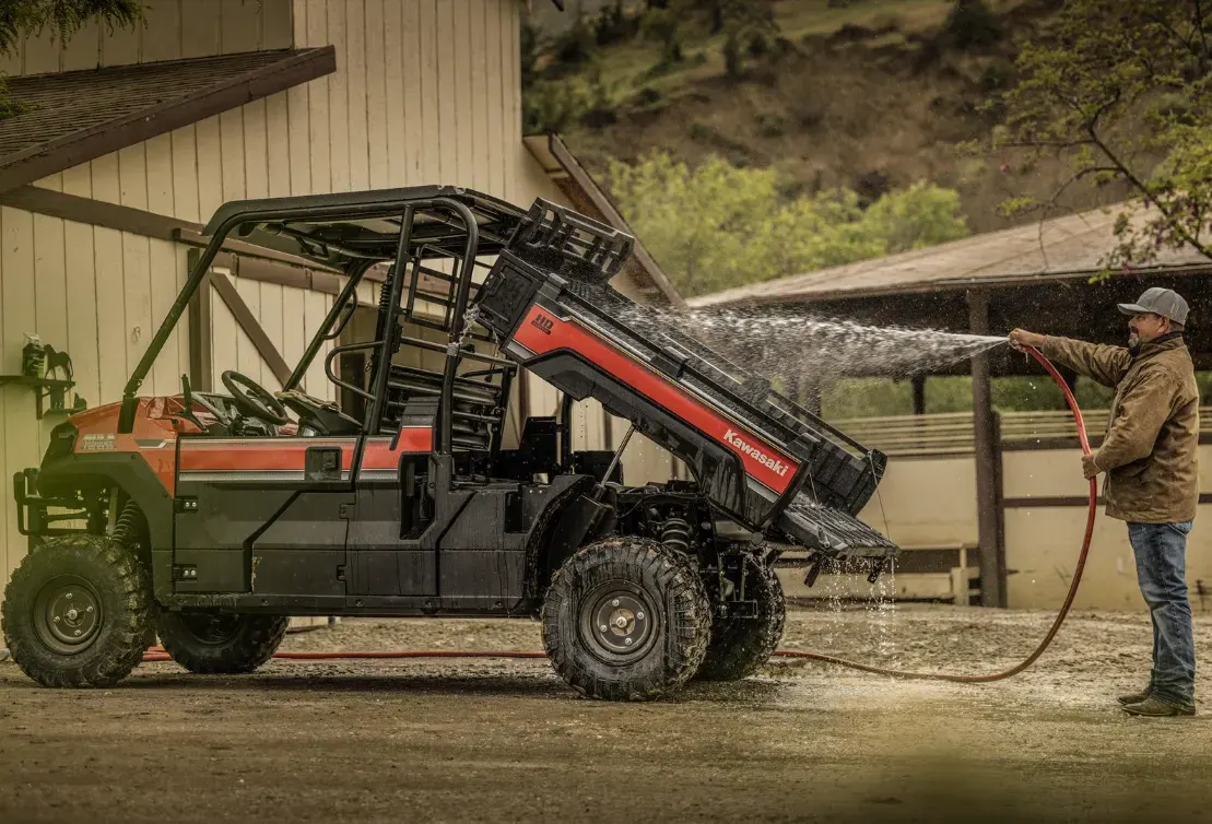 Kawasaki Mule Pro FX UTV being washed with a hose