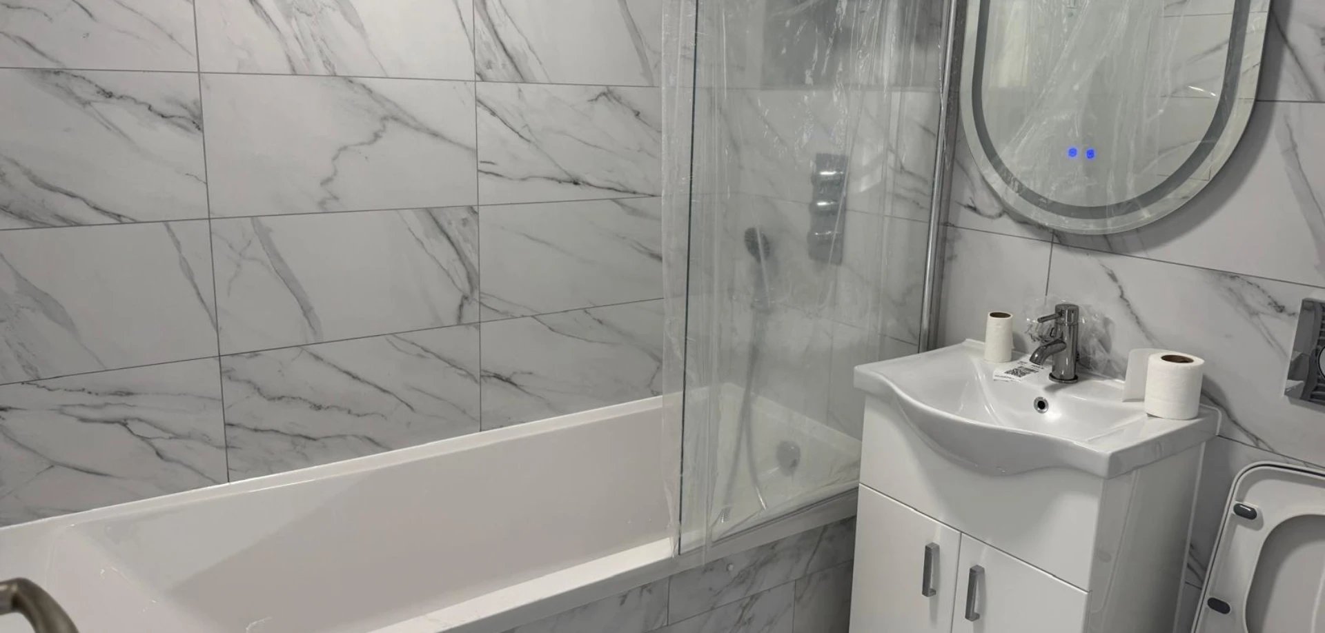 Luxury bathroom with freestanding bathtub and brass fixtures