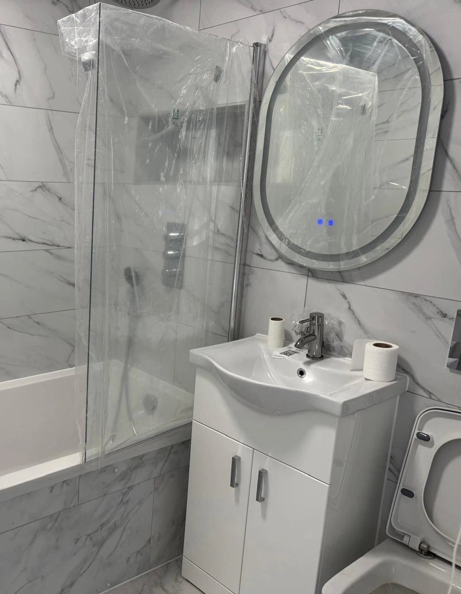 Luxury freestanding bathtub with brass fixtures