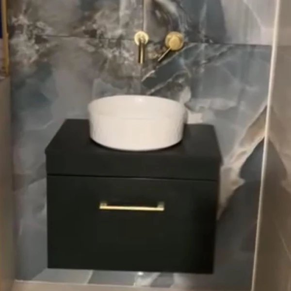 Marble vanity with brass tap detail