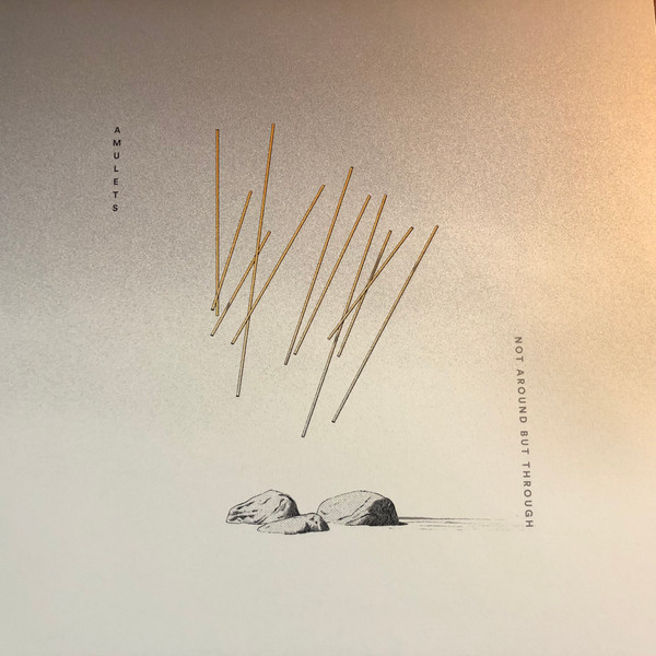 AMULETS — NOT AROUND BUT THROUGH