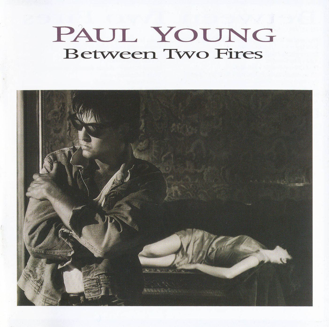 PAUL YOUNG — BETWEEN TWO FIRES