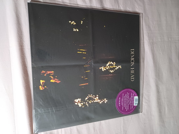 DEMON HEAD — THROUGH HOLES SHINE THE STARS