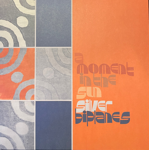 SILVER BIPLANES — A MOMENT IN THE SUN